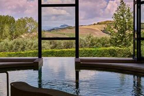 The Fonteverde resort indoor pool with beautiful Tuscany view 