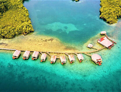Spectacular aerial view over-the-water bungalows of the Punta Carasol Acqua Lodge