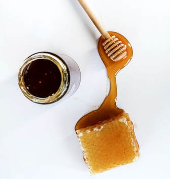 A jar of honey and honeycomb